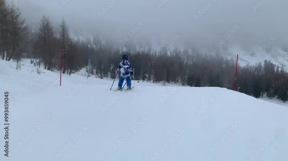 Children and adults, happy family in winter clothing at ski vacation, skiing, wintertime Children and adults, happy family in winter clothing at ski vacation, skiing, wintertime