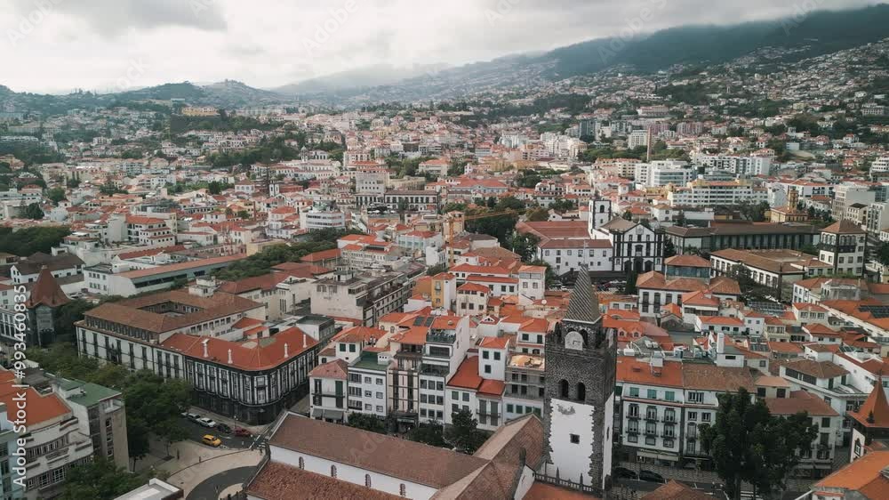 Funchal city aerial drone video with the Cathedral of Our Lady of the Assumption, Old Town of Funchal, Madeira Island, Portugal. Aerial drone view. Funchal city aerial drone video with the Cathedral of Our Lady of the Assumption, Old Town of Funchal, Madeira Island, Portugal. Aerial drone view.