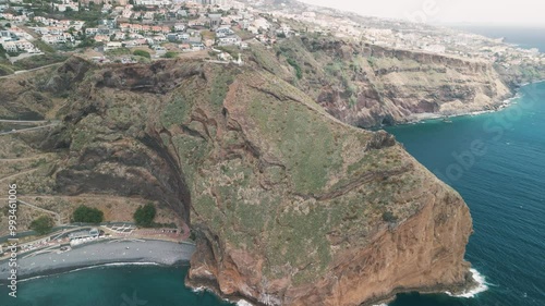 Peninsula with Christo Rei (Christ's Monument) on the Madeira Island near Canico, Portugal. Aerial drone video.