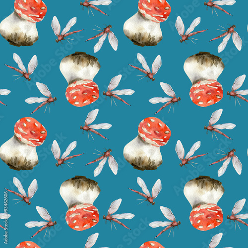 Red agaric mushrooms and dragonflies seamless pattern on blue. Not edible fungus with insects hand drawn background for seasonal packing, textile, fabric design. Kitchen and home decor photo