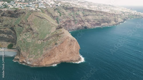 Peninsula with Christo Rei (Christ's Monument) on the Madeira Island near Canico, Portugal. Aerial drone video.