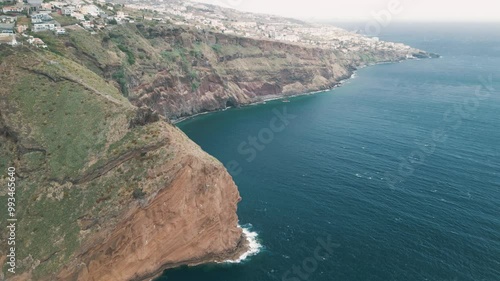 Peninsula with Christo Rei (Christ's Monument) on the Madeira Island near Canico, Portugal. Aerial drone video.