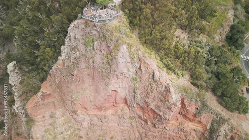 People visiting the viewpoint on Cabo Girao located on the cliff on the Madeira Island, Portugal. Top down view from the cliff.