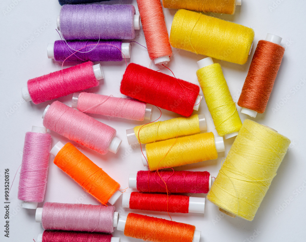 Top view of many colorful thread spools background Top view of many colorful thread spools background