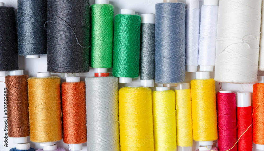Top view of many colorful thread spools background Top view of many colorful thread spools background