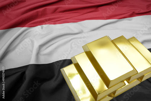 shining golden bullions on the yemen flag background.