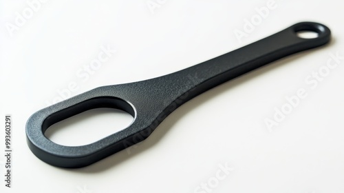 Close-up of a black matte bottle opener with modern design, sharp focus, isolated on white, soft shadows, ample blank space for text overlay