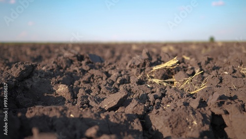 combines plowed field. modern farming and irrigation business concept. fresh arable land after the tractor before sowing. clods of dirty ground on lifestyle a plowed field close-up