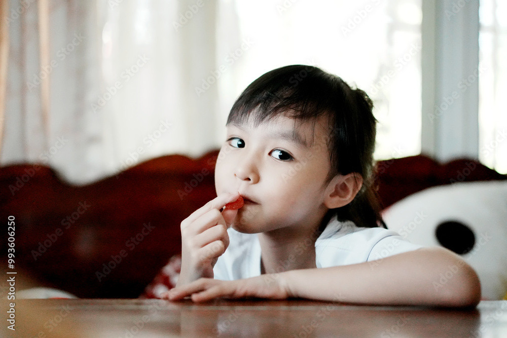 Little girl eating gelatin candy. Happy kid with vitamin. Little girl eating gelatin candy. Happy kid with vitamin.