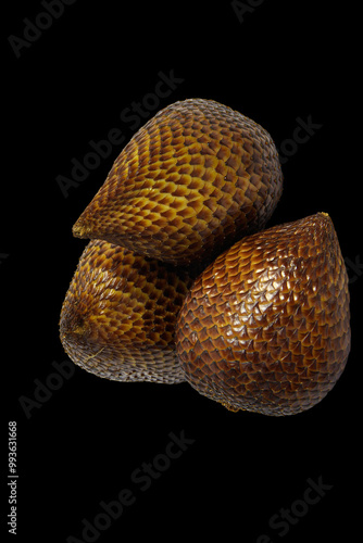 Tropical delight of Snake Fruit isolated on black background with clipping path