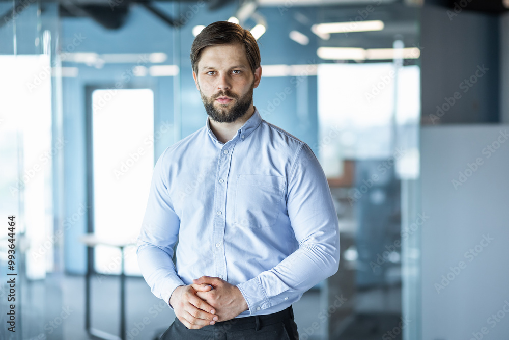 Confident Businessman in Modern Office Environment Confident Businessman in Modern Office Environment