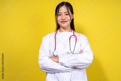 A woman in a white lab coat is posing for a picture