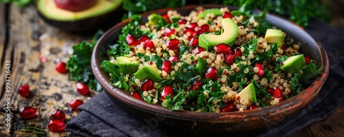 Nutrient-packed quinoa salad with kale, avocado, and pomegranate, photographed in rustic style, natural daylight, high contrast photo