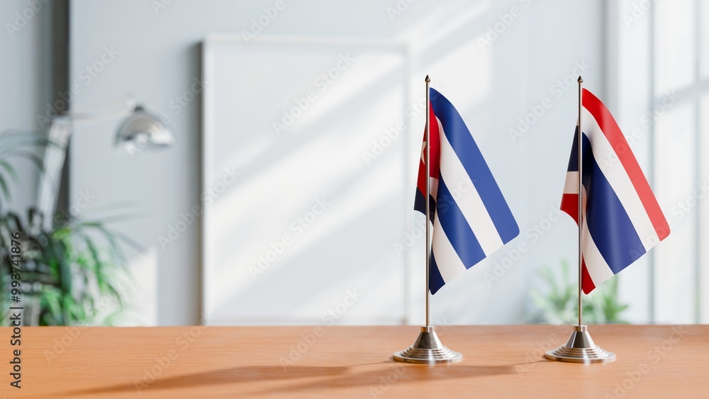 FLAGS OF CUBA AND THAILAND ON TABLE FLAGS OF CUBA AND THAILAND ON TABLE