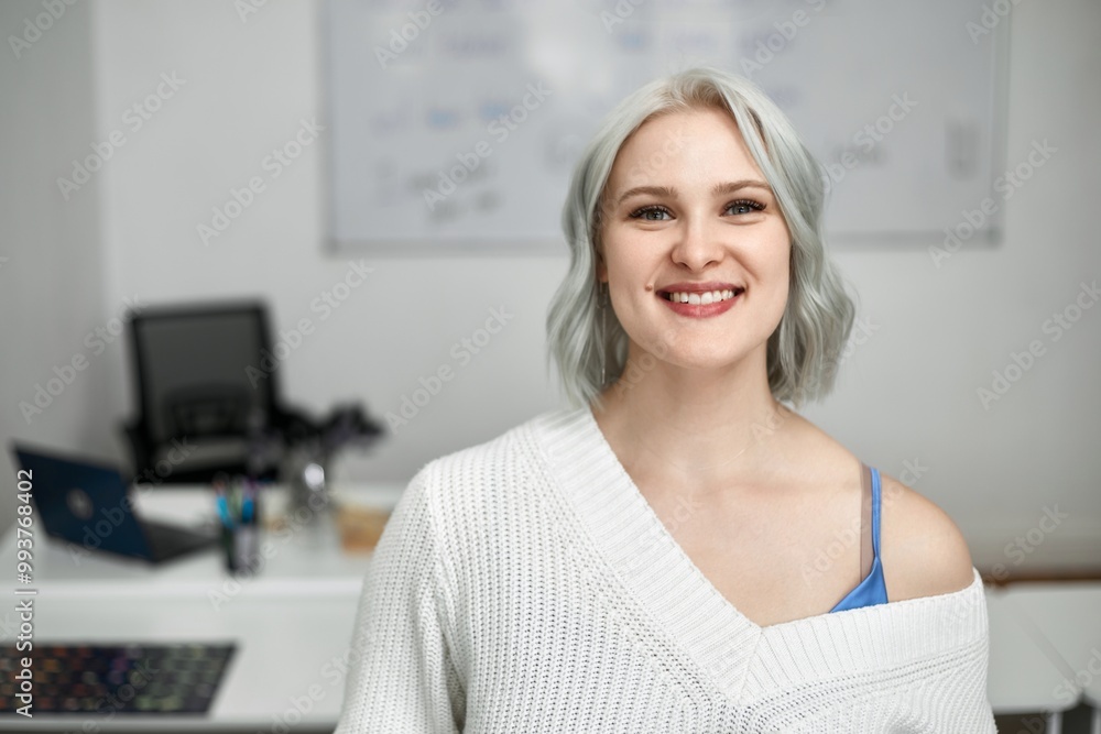 English tutor at a computer in the classroom. Concept of learning foreign languages. English tutor at a computer in the classroom. Concept of learning foreign languages.