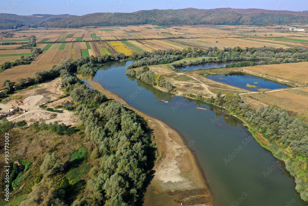 Aerial view of gravel pit mining reservoir and river, ballast, ecological impact on environment Aerial view of gravel pit mining reservoir and river, ballast, ecological impact on environment