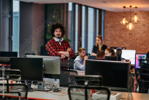 Strategic Business Meeting: Group of Professionals Collaborating in Office Using Computers photo