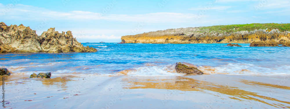 Obraz premium Wild shore with rocks and stones along the coast of northern Spain, Muxia, Galicia, September 12, 2024