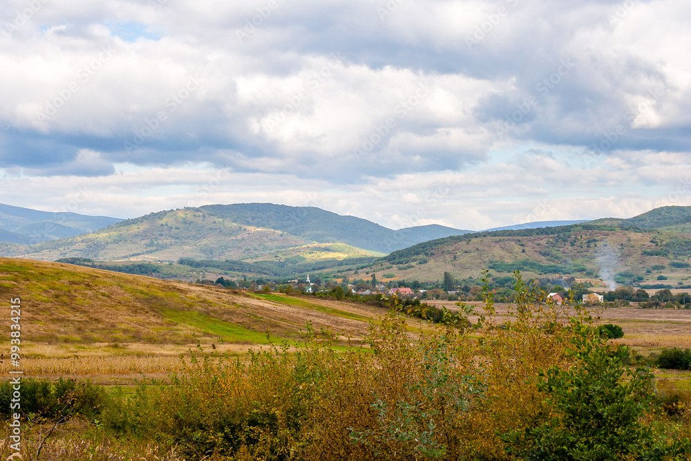 countryside of ukraine. cloudy afternoon. autumn landscape in mountains. grassy field and rolling hills. rural scenery