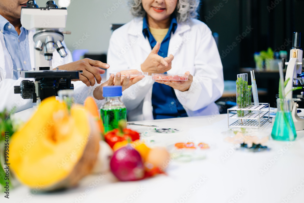 Food scientists in lab coats, testing samples, and analyzing food safety and quality in a modern laboratory Food scientists in lab coats, testing samples, and analyzing food safety and quality in a modern laboratory