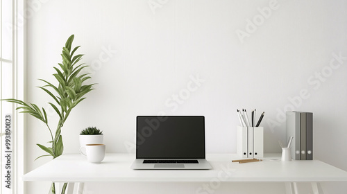 Minimalist corner desk setup with a closed laptop, a cup of coffee, and a neatly organized workspace. The background features clean, white walls and natural light