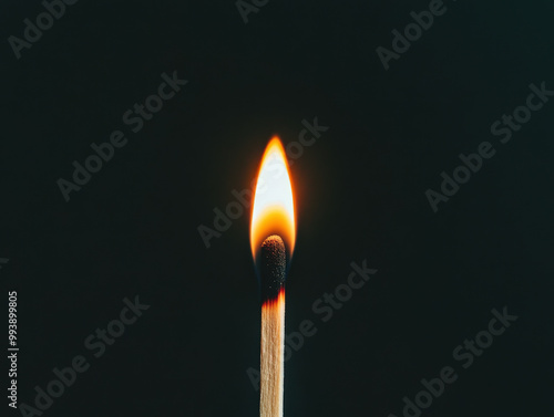 Bright Matchstick Flamed Against Dark Background