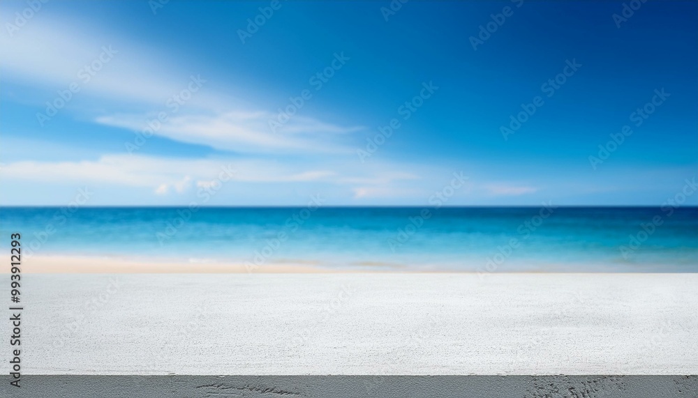 Fototapeta premium Concrete table top against the background of the sea on the beach. Empty white countertop for product presentation with blue water and sky. Outdoor mockup