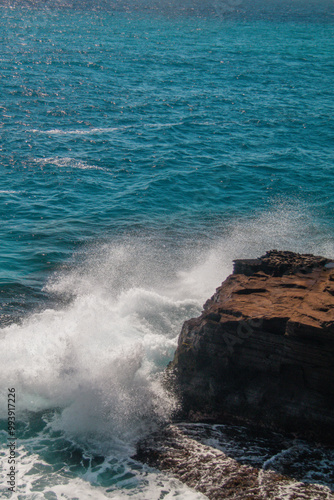 Waves crashing against a rocky cliff