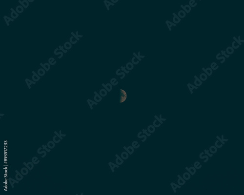 dark sky with a small crescent moon
