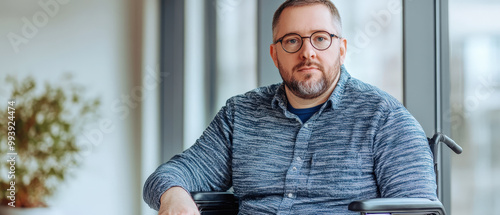European Individual in Wheelchair Looking Thoughtful