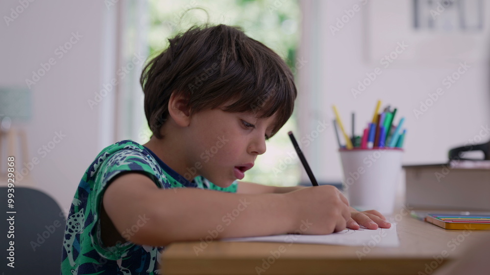 Child concentrating on his artwork, pencil in hand, surrounded by coloring supplies, engaged in creative activity at home, natural light from a nearby window Child concentrating on his artwork, pencil in hand, surrounded by coloring supplies, engaged in creative activity at home, natural light from a nearby window
