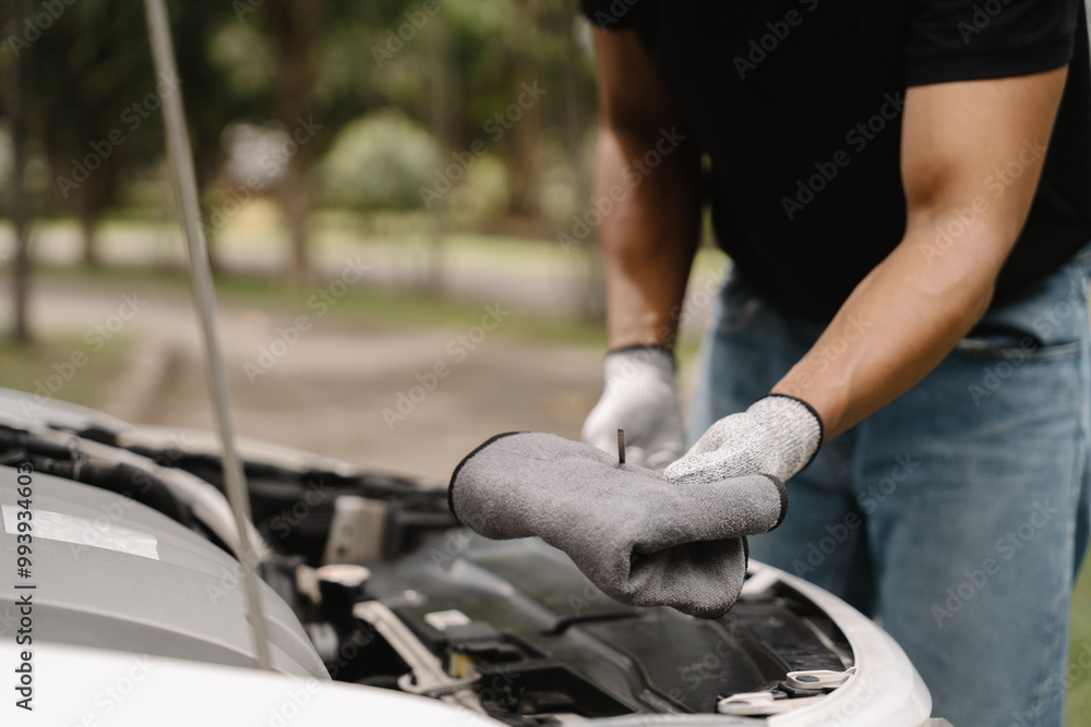 Mechanic Checking Car Engine Oil Level Mechanic Checking Car Engine Oil Level