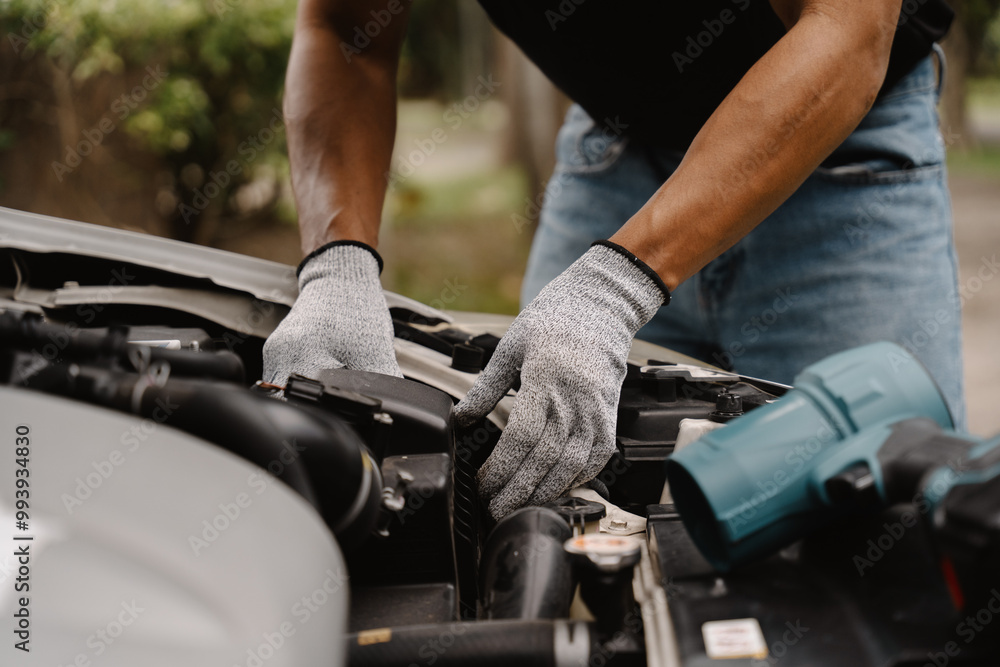 Mechanic Hands: A close-up of a mechanic's hands, working on a car engine, showcasing the precision and expertise of automotive repair. Mechanic Hands: A close-up of a mechanic's hands, working on a car engine, showcasing the precision and expertise of automotive repair.