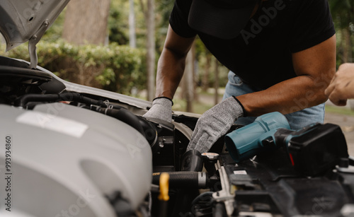 Car Engine Repair: Mechanic working on car engine. 