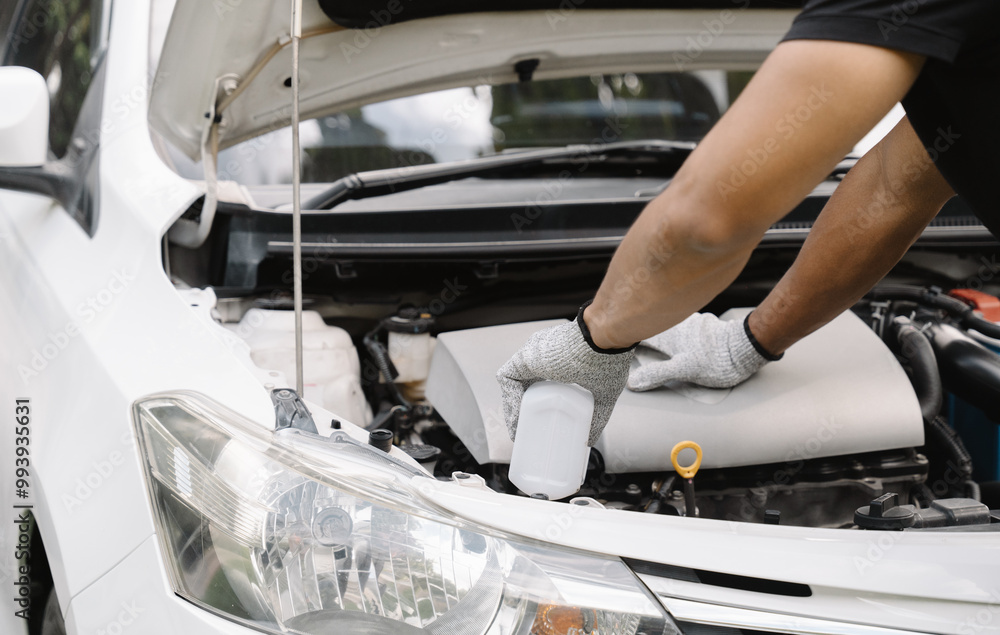Φωτογραφία Mechanic's Precision:  A close-up shot of a mechanic's hands meticulously working on a car engine, showcasing expertise and dedication to automotive repair