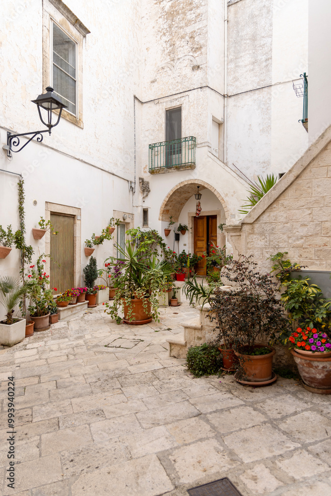 View of picturesque narrow, stone street typical of Mediterranean countries, Locorotondo, Italy, Apulia