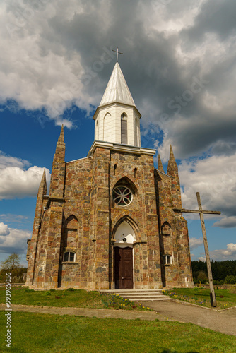 The Catholic church. The old red brick church. A historical building with a religious purpose.