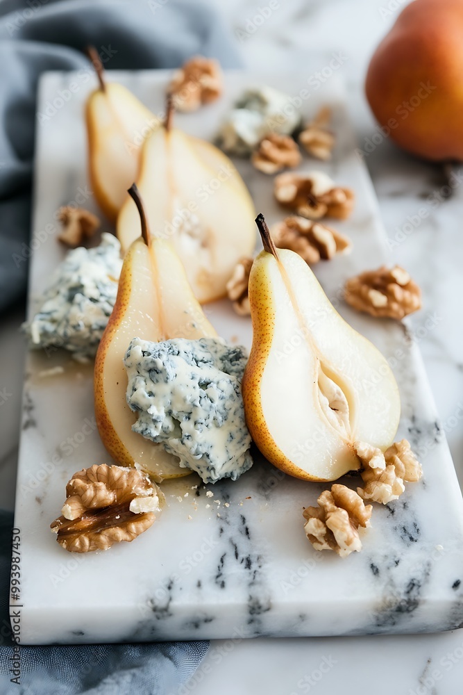 Pears Stuffed with Blue Cheese and Walnuts on a Marble Board. Pears Stuffed with Blue Cheese and Walnuts on a Marble Board.