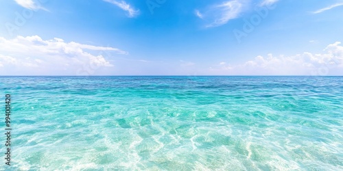 bright blue ocean surface on sunny day with blue sky background