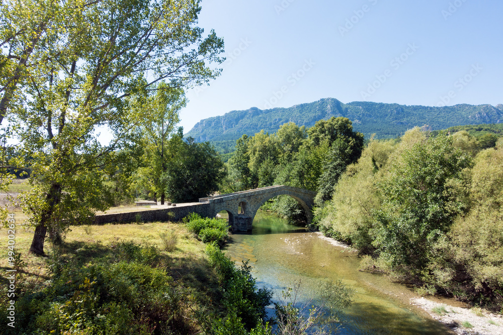 Amazing scenery by the river near Ziakas old stone bridge, Grevena, Greece Amazing scenery by the river near Ziakas old stone bridge, Grevena, Greece