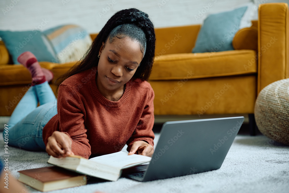 Black female student learning at home. Black female student learning at home.