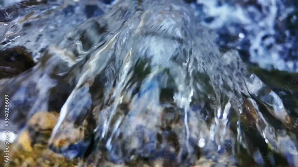 Aerial View of Water Falling from a Small Waterfall in Slow Motion Aerial View of Water Falling from a Small Waterfall in Slow Motion