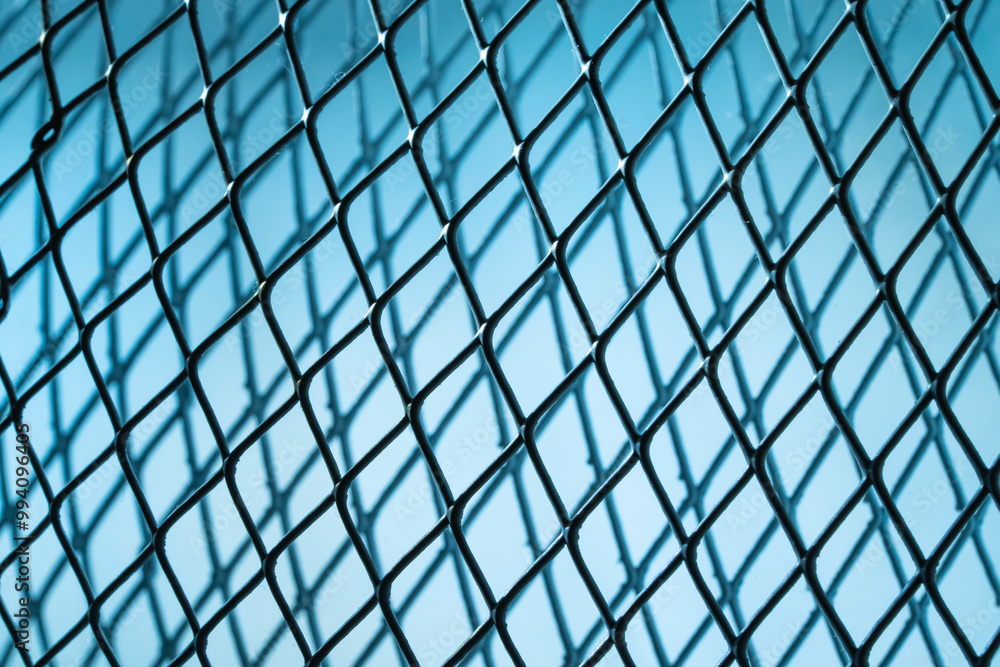 Steel mesh netting with blue background Steel mesh netting with blue background