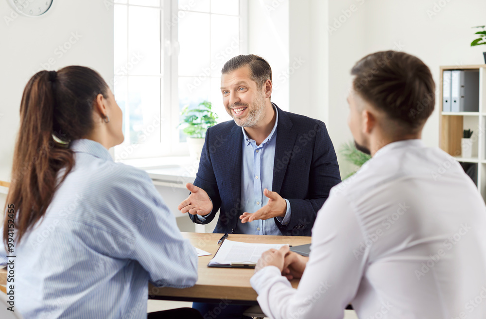 © Studio Romantic - Husband and wife, clients hold a briefing with a financial agent or real estate consultant as clients. The meeting focuses on investment strategies and property decisions for future plans.
