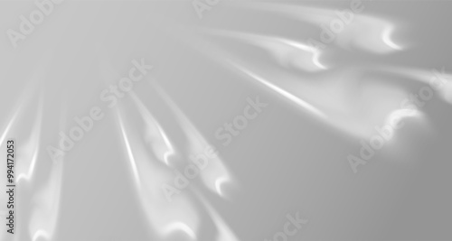 Glare from the sun's rays on the wall. Blurred shadows in the room. Soft overlay of natural light. Abstract background for product presentation.Natural light layout.