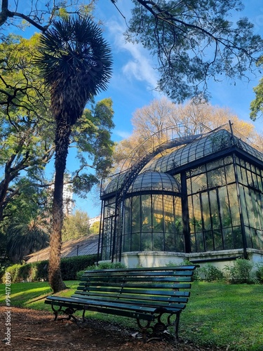 Greenhouse with a Bench and Tall Trees in the Buenos Aires Botanical Garden

