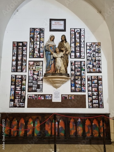 Holy Family Statue with Photos in Immaculate Heart of Mary Church

