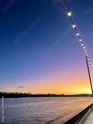 Sunset over river and city 