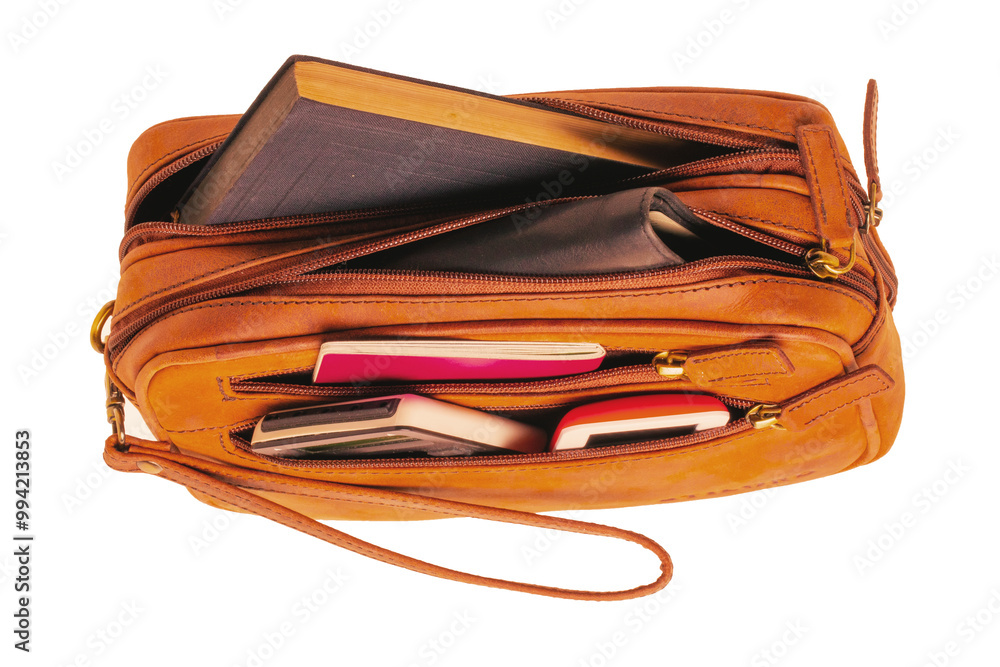 Leather handbag isolated. Close-up of brown businessman luxury leather wrist handbag. Fashionable brown leather briefcase or bag for men. Macro. Leather handbag isolated. Close-up of brown businessman luxury leather wrist handbag. Fashionable brown leather briefcase or bag for men. Macro.