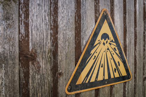 Explosives sign on a weatered wooden door. photo